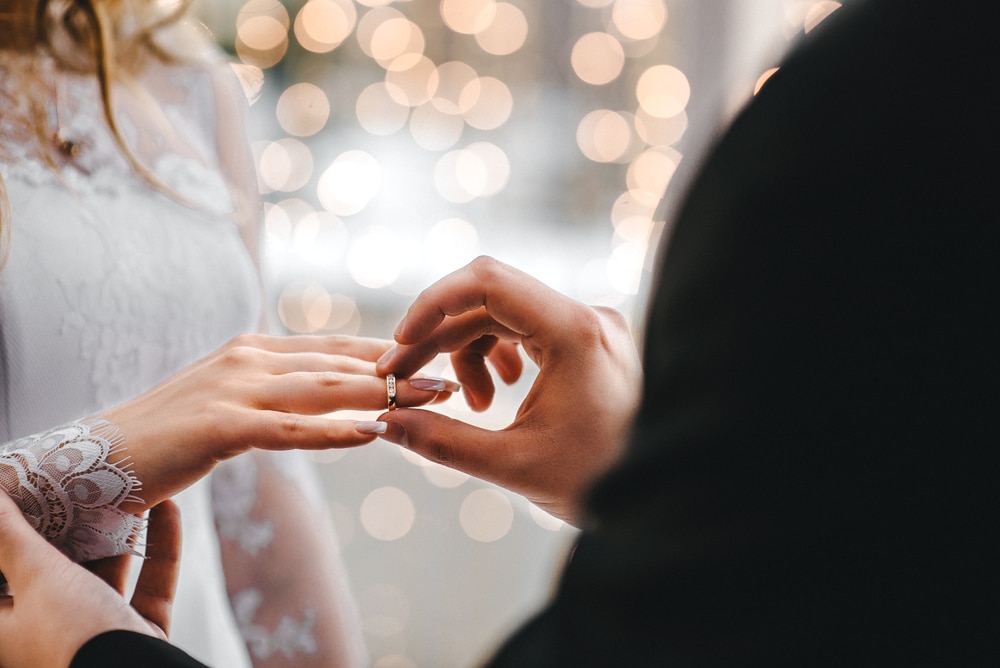 Plan Your Wisconsin Elopement at Justin Trails Resort in 2023, photo of a couple exchanging rings